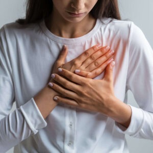 Woman With Her Hands Her Chest (1)
